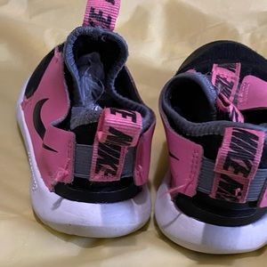 Nike pink and black sneakers for girls